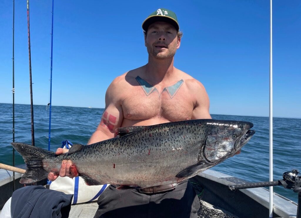 Man holding salmon caught at buoy 10
