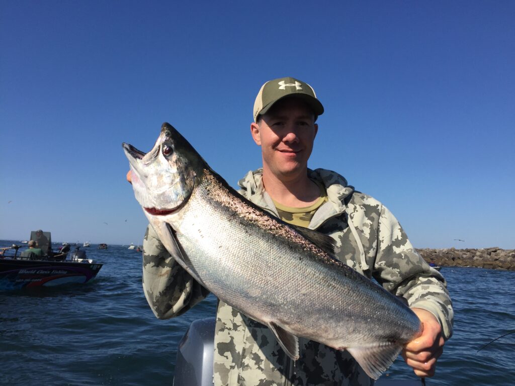 Man holding salmon at Columbia buoy 10
